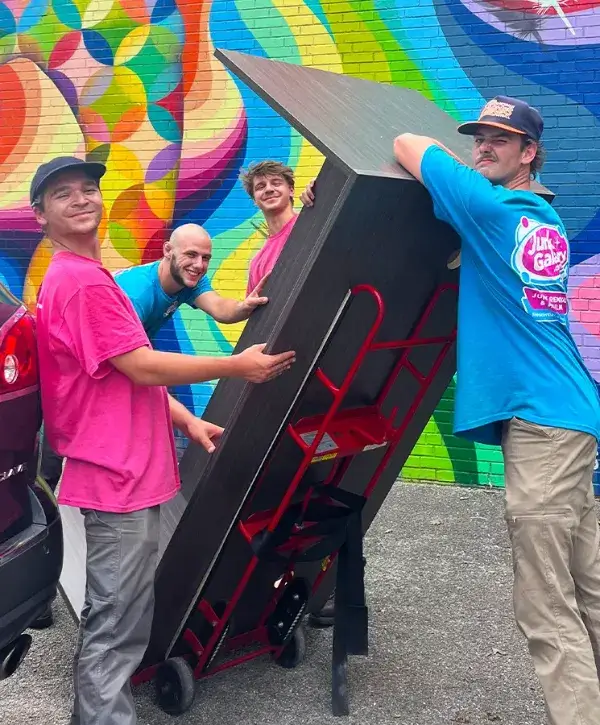 junk galaxy workers moving furniture
